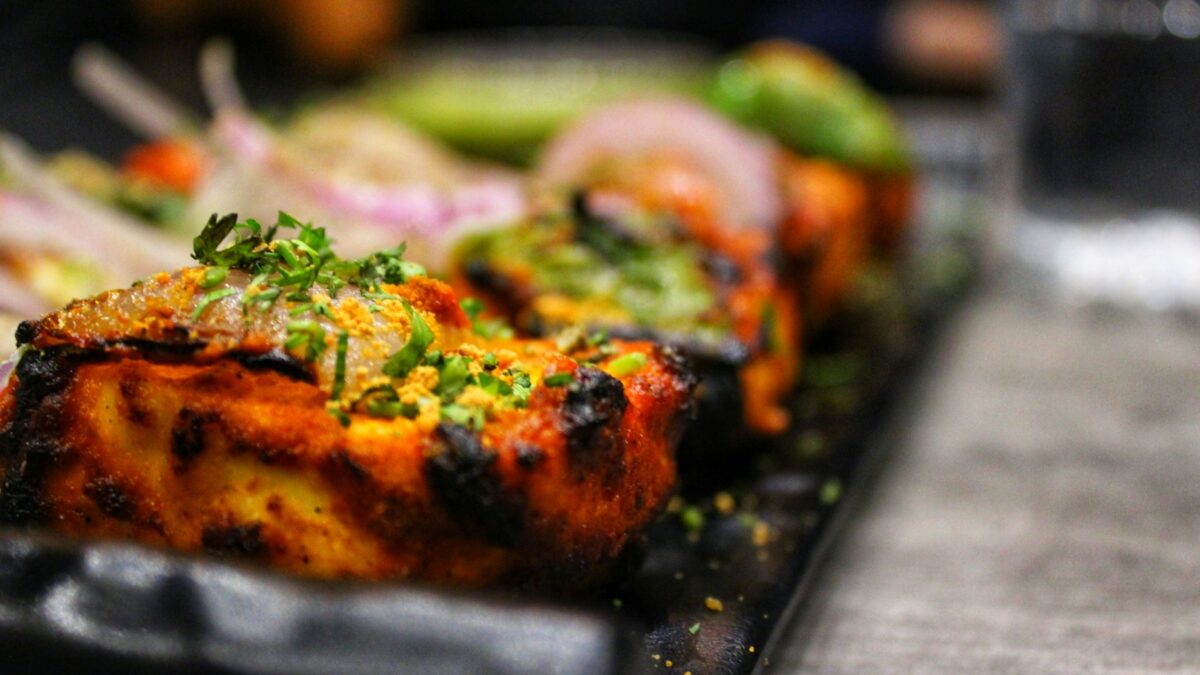 selective focus photography of grilled beef tops with vegetables