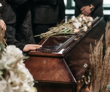 A Person Holding a Wooden Coffin