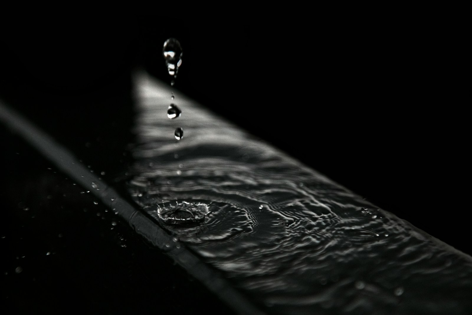 water droplets on black surface
